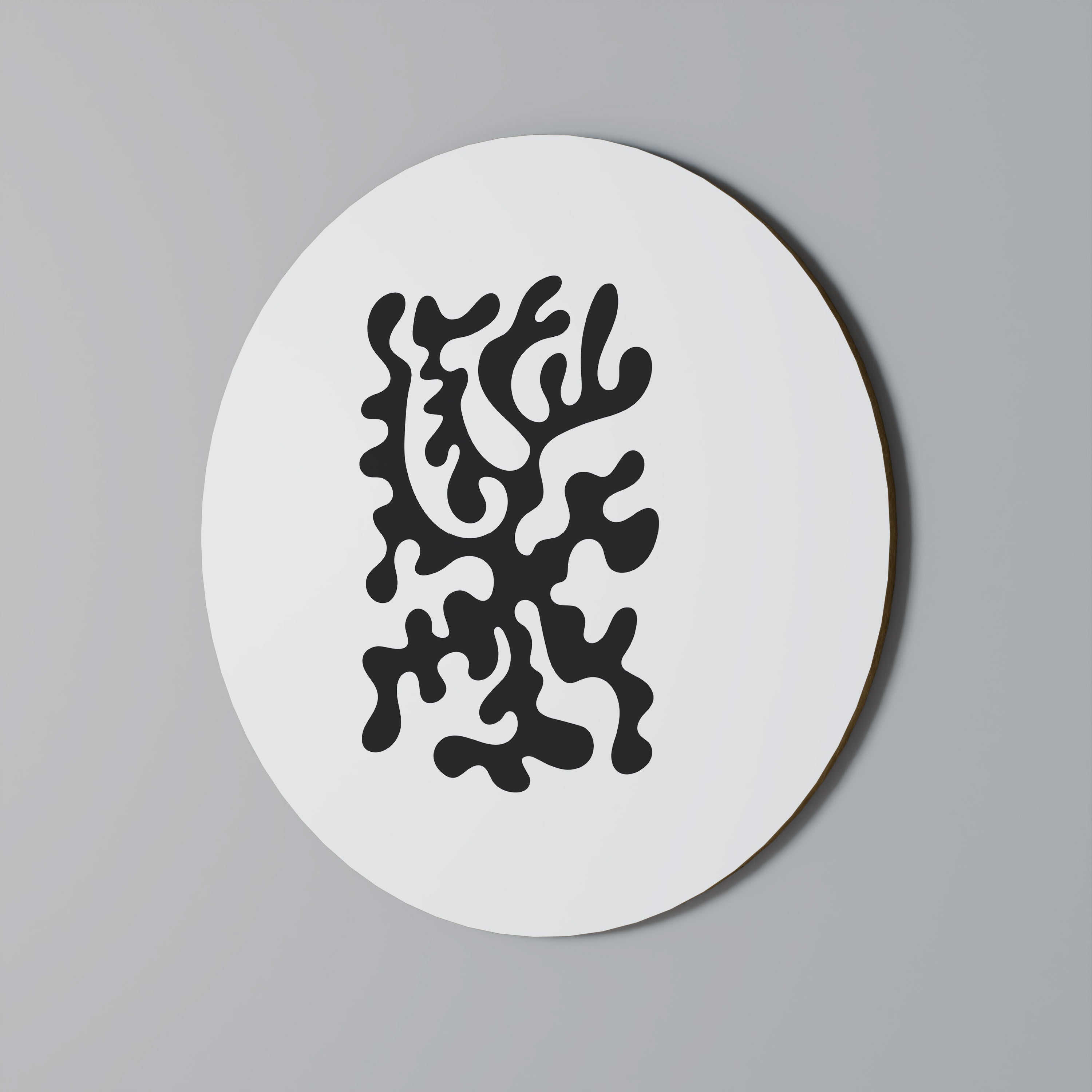 Rund väggdekoration med träkolsmönster