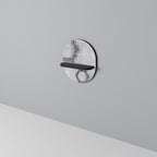 HEXAGONALA FIGURER Oval konsthylla i svart finish