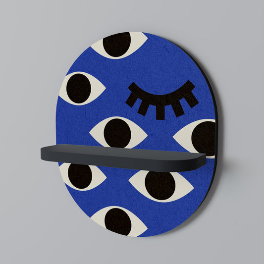 GEOMETRISKA ÖGON Oval konsthylla i svart finish
