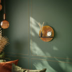 STRENGTHENING RELATION Round Art Shelf In Black Finish