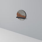 RANDIG TERRÄNG Rund konsthylla i svart finish