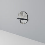 FADE IN THE TREES Oval konsthylla i svart finish