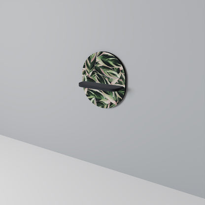 EERIE STROMANTHE Oval konsthylla i svart finish